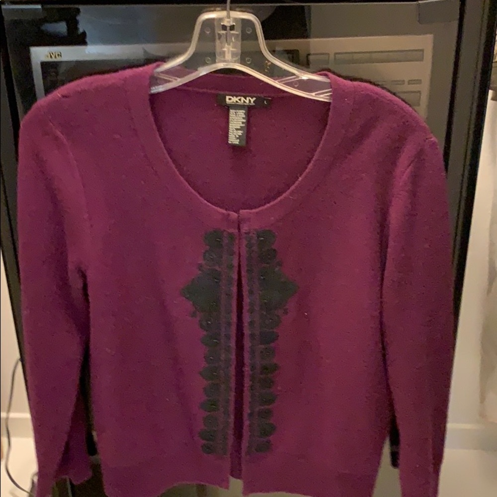 Sweater with a black beaded front.